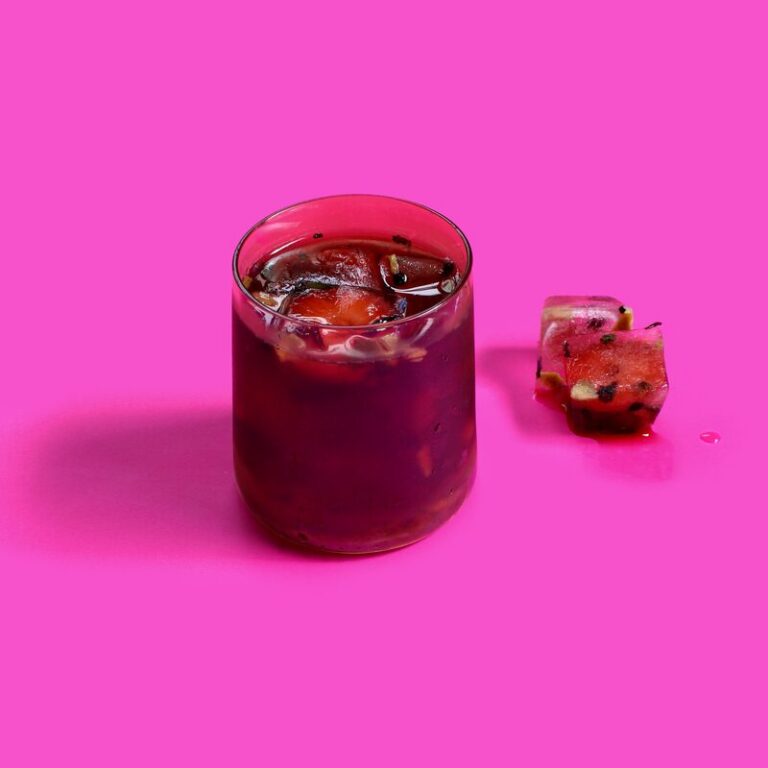 Red iced drink on magenta